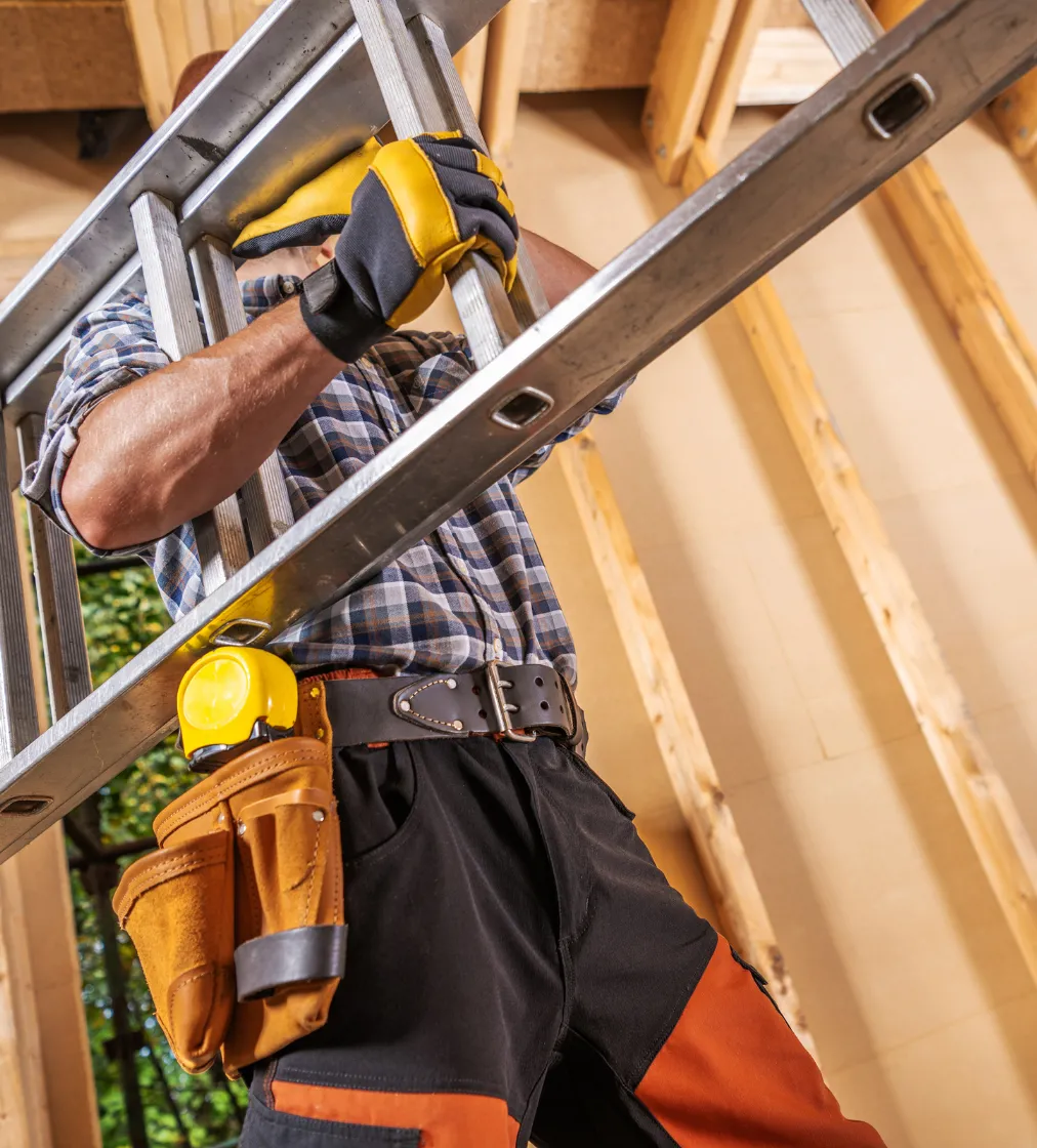 Contractor drilling wood framing during ADU construction in Los Angeles