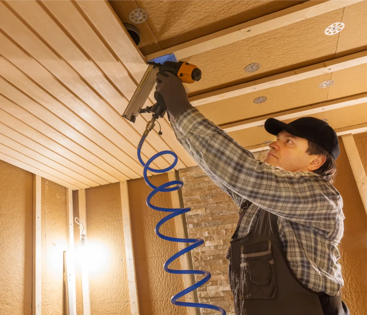 Construction worker performing interior work for garage conversion ADU project in Los Angeles