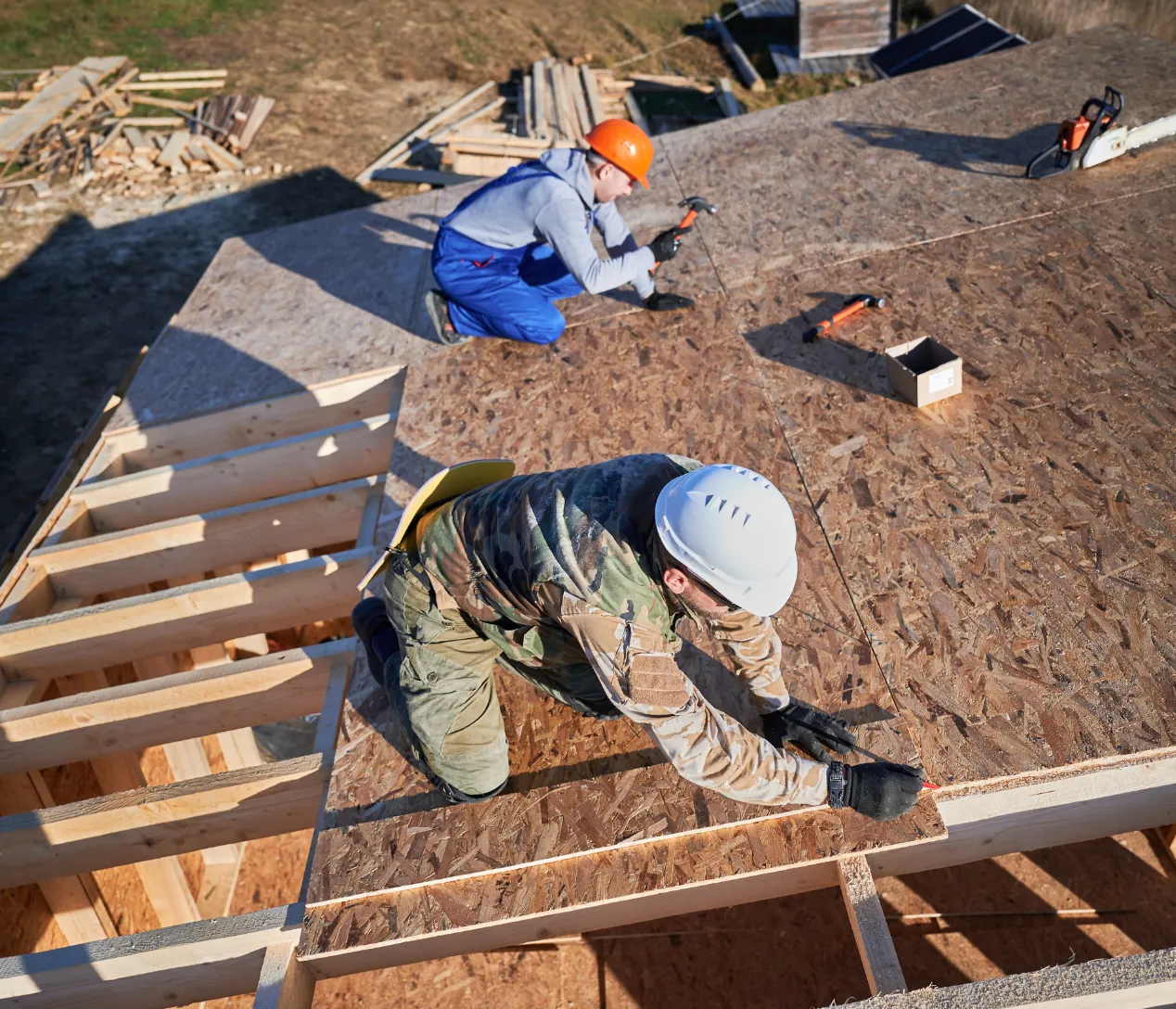 Contractor inspecting wood framing for a custom ADU construction project at a Los Angeles home