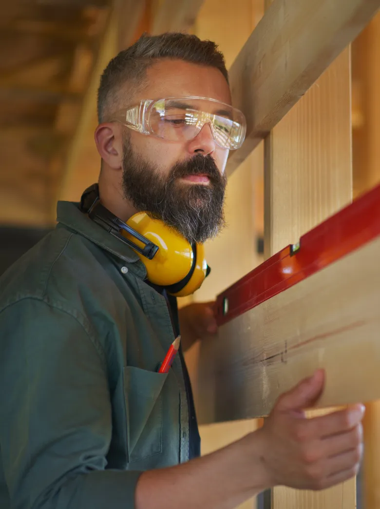 Professional ADU construction contractor installing exterior siding with precision on a modern accessory dwelling unit in Los Angeles