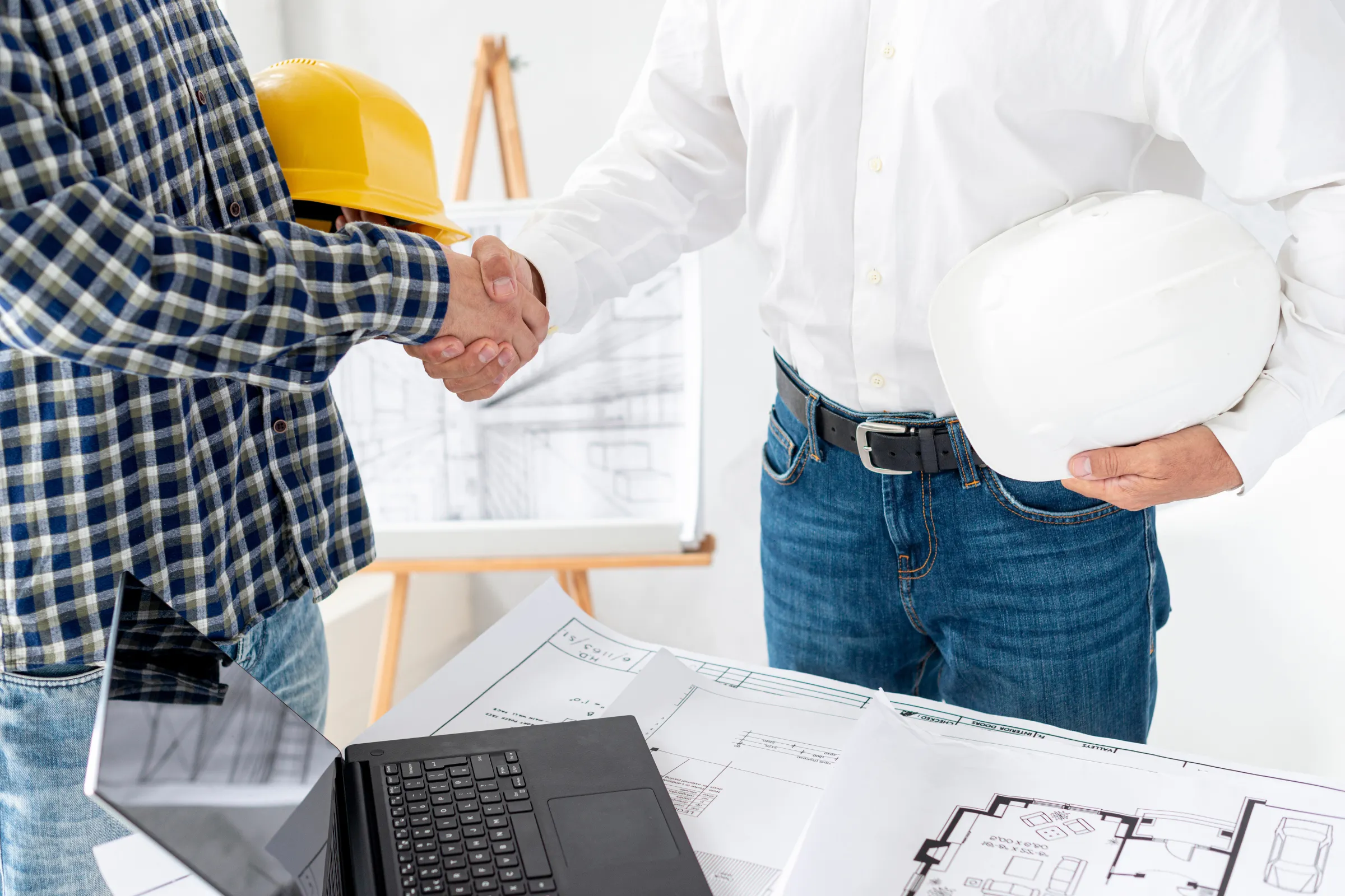 ADU permits Los Angeles contractor meeting with homeowner reviewing plans and documents for city approval process