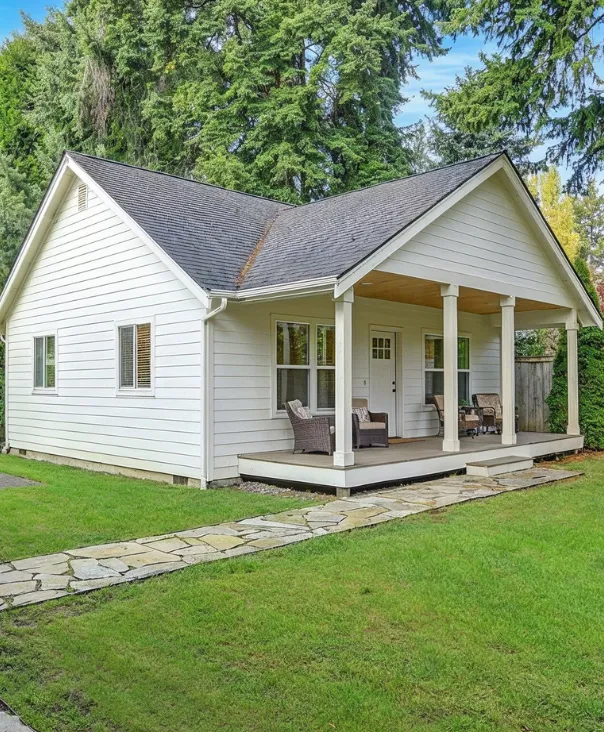 Detached ADU in Los Angeles showing finished small home with front porch, modern exterior, and landscaped yard